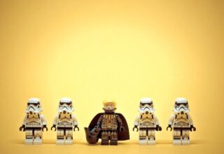 Four stormtroopers are standing in a line with Darth Trump leading them on a yellow background. Illustrative editorial. January 20, 2025. By kirill_makarov - AdobeStock